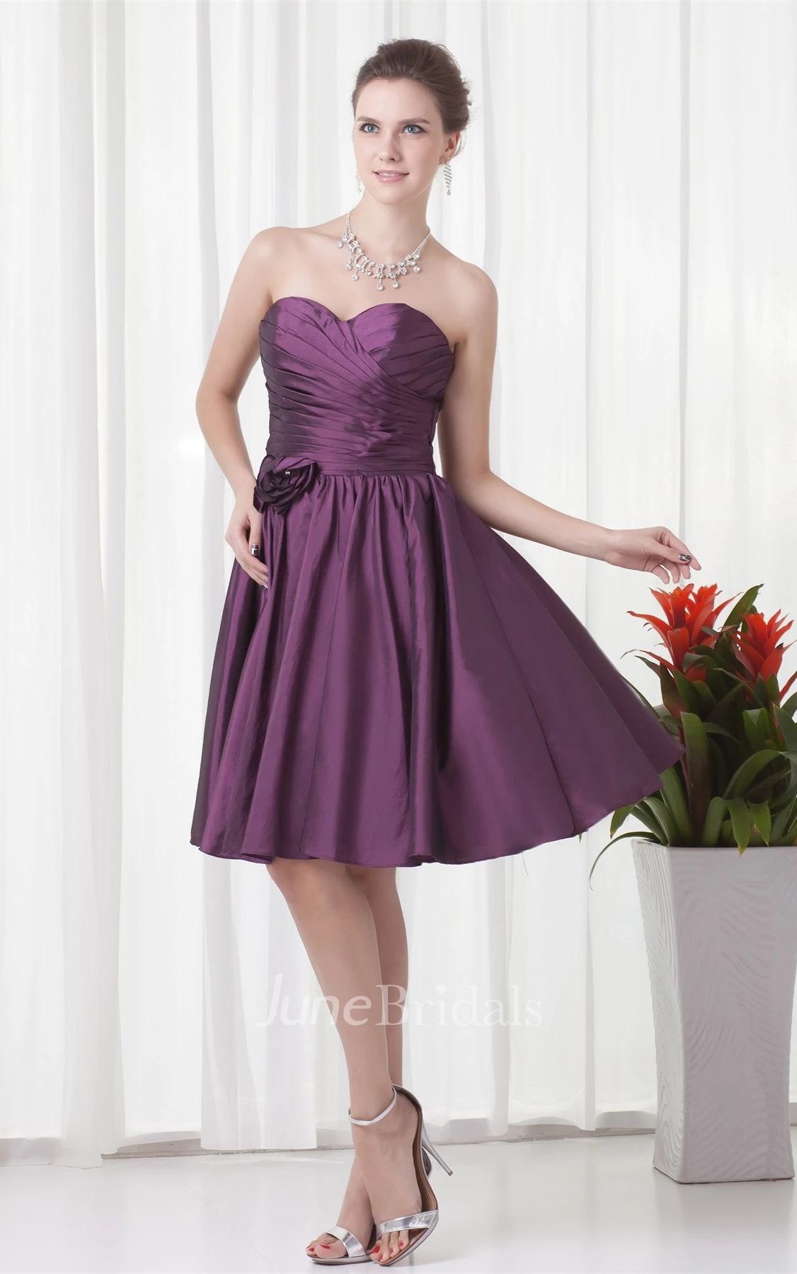 sweetheart knee-length criss-cross dress with pleats and flower