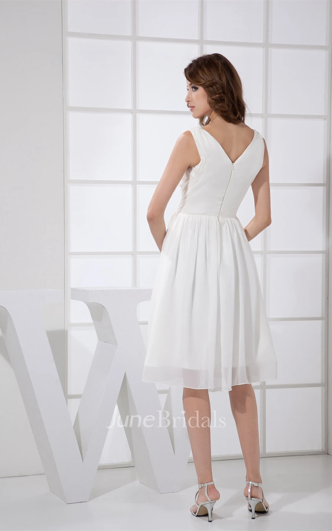 Sleeveless Low-V-Back Knee-Length Dress with Ruching and Pleats