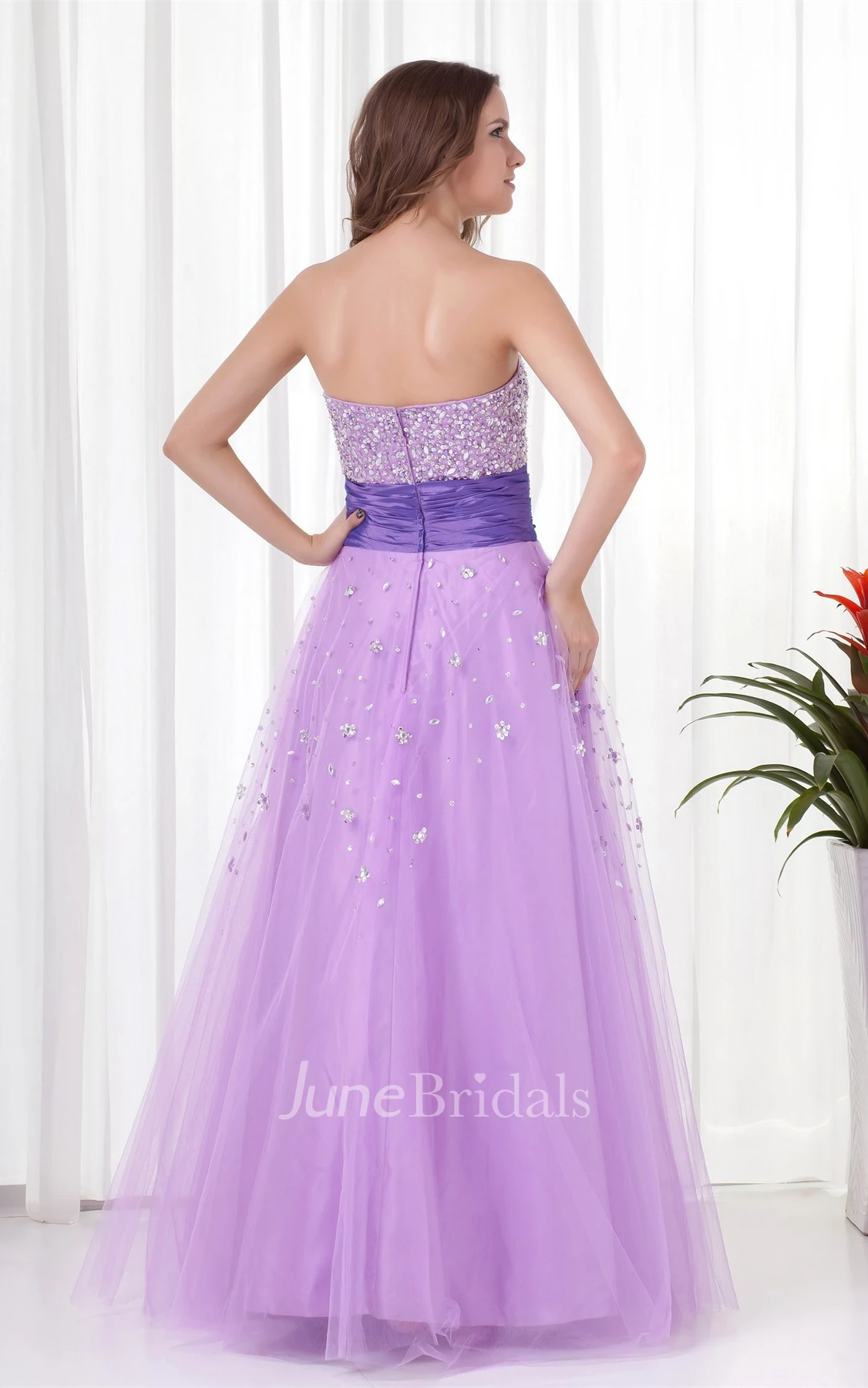 strapless a-line tulle dress with ruched waist and jeweled top