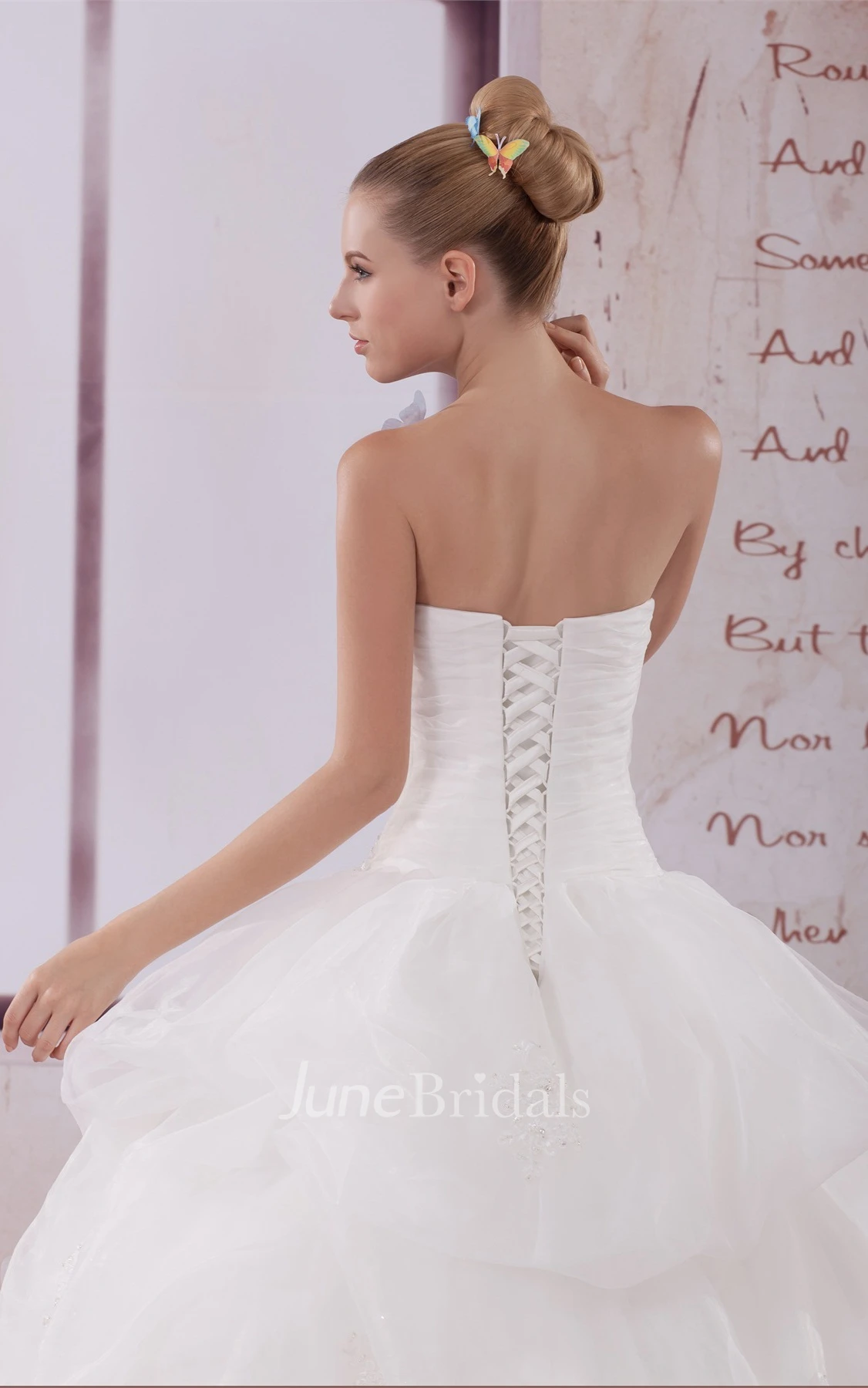 Strapless Appliqued Ball Gown with Ruching and Corset Back