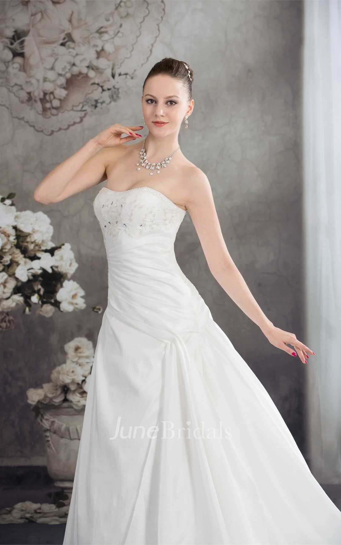 Strapless Appliqued Ball Gown with Beading and Ruching