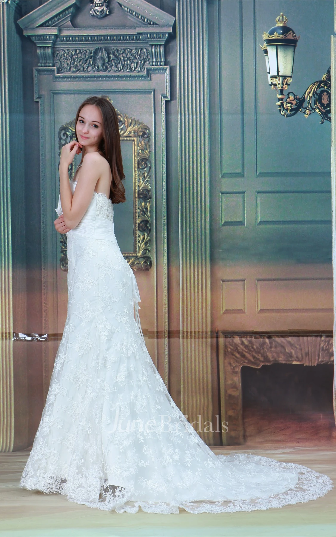 strapless a-line mermaid gown with bow and central ruching