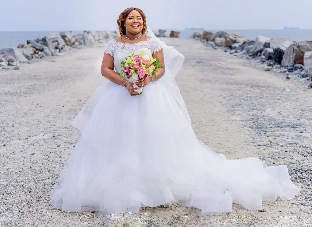 Gorgeous Plus Size Wedding Dresses Summer Lace Cap Sleeves A Line Beach Bridal Gowns With Pink Ribbon Sash Tulle Puffy Wedding Dresses June Bridals