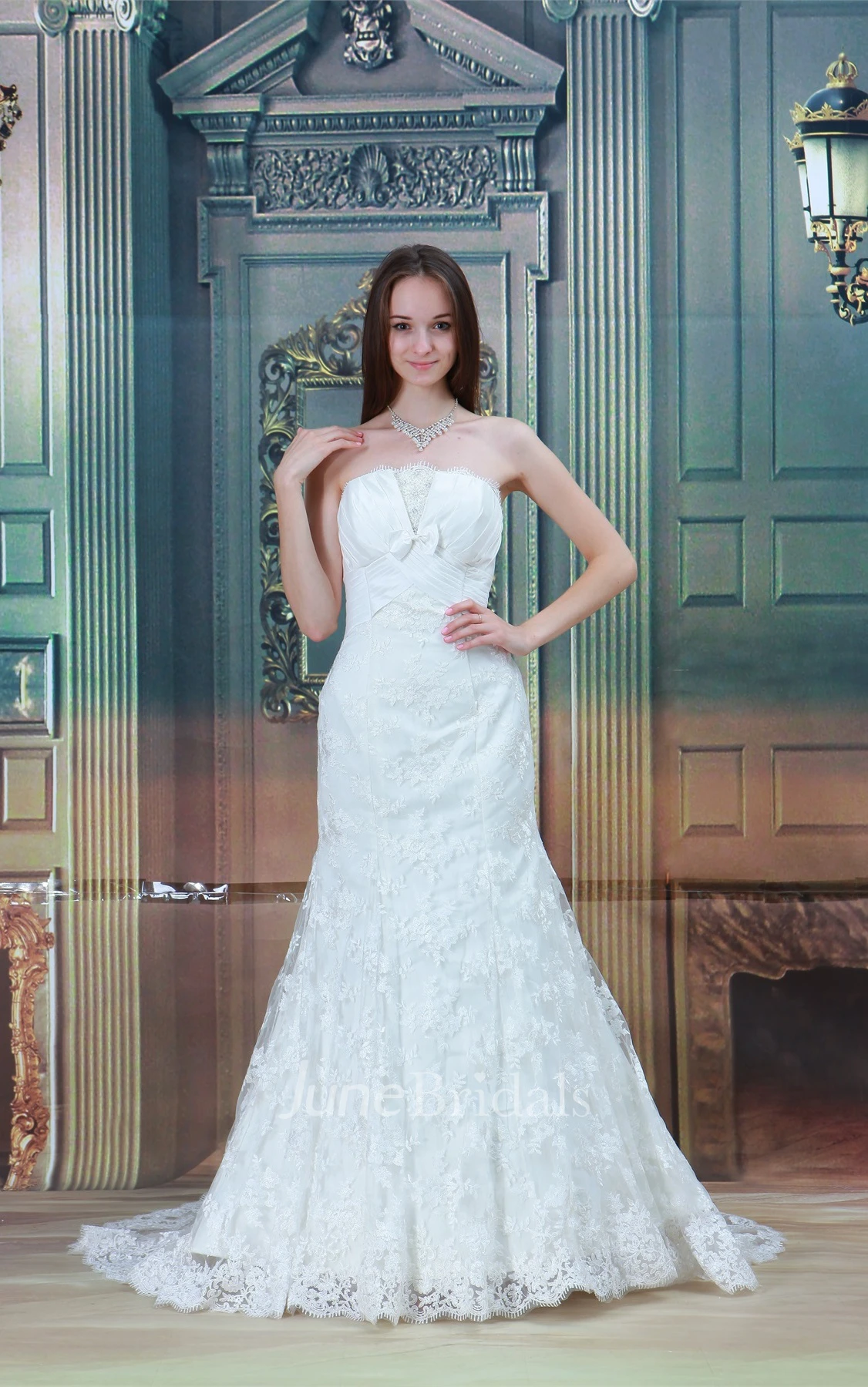 strapless a-line mermaid gown with bow and central ruching