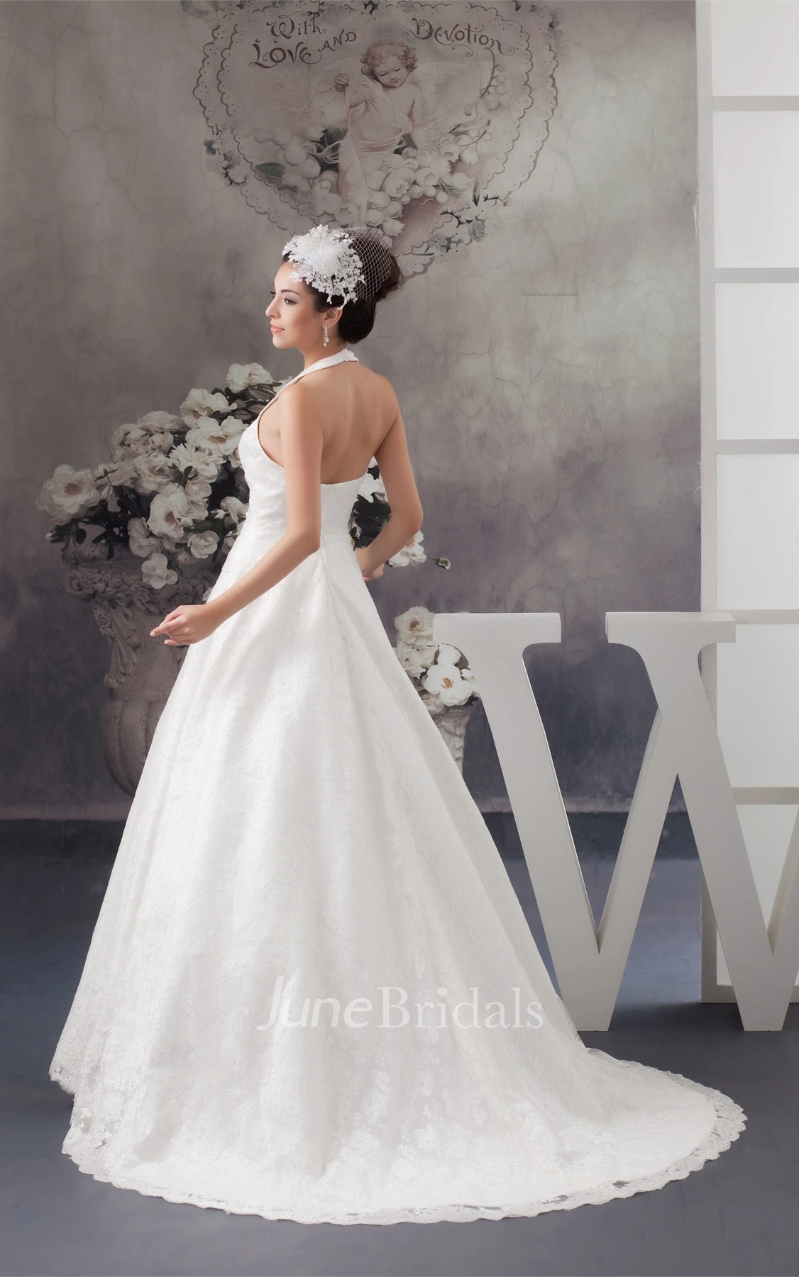 Sleeveless A-Line Appliqued Gown with Ruching and Halter