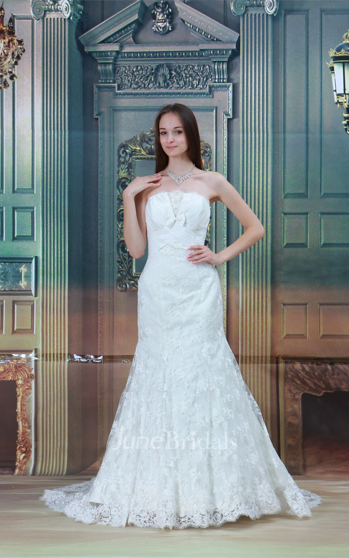 strapless a-line mermaid gown with bow and central ruching