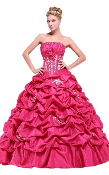 Strapless Ball Gown With Ruffles and Flower Detail