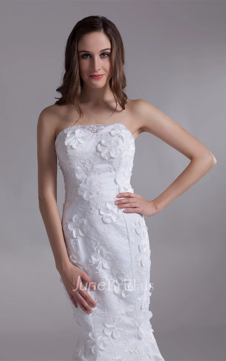 strapless lace mermaid dress with brush train and floral embellishment