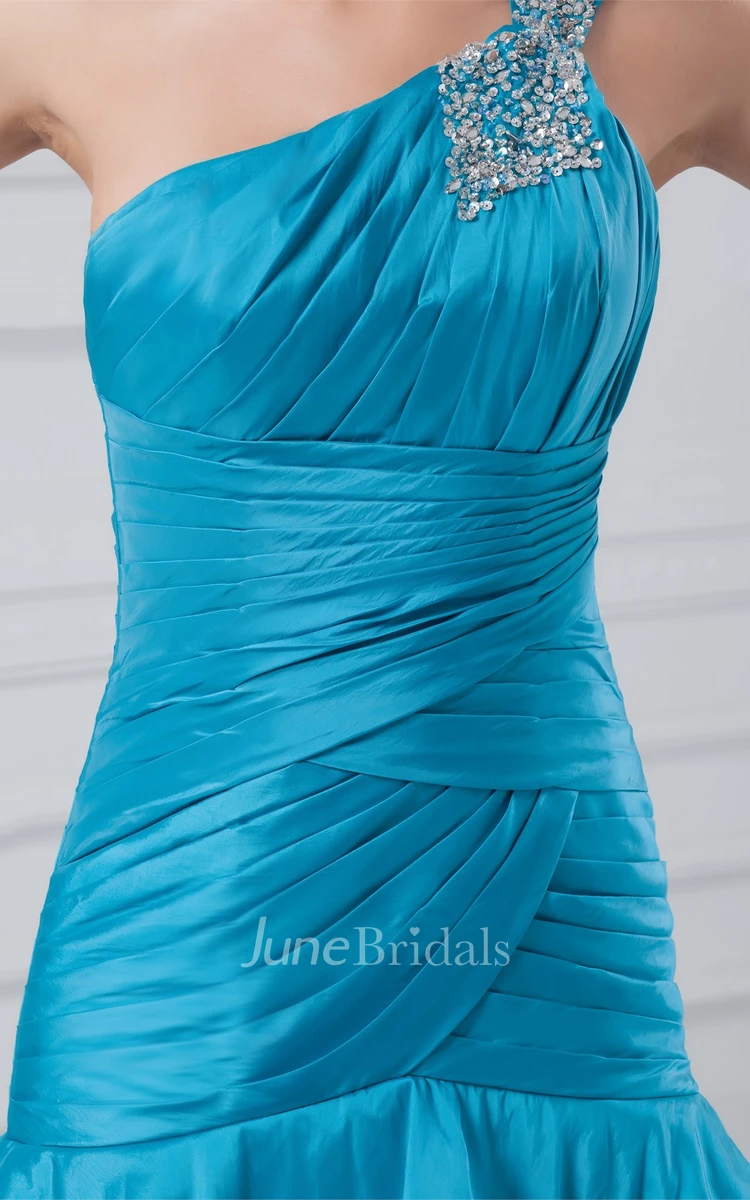 one-shoulder a-line ruched gown with tiers and beading