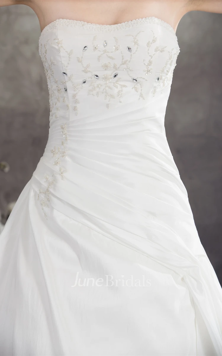 Strapless Appliqued Ball Gown with Beading and Ruching