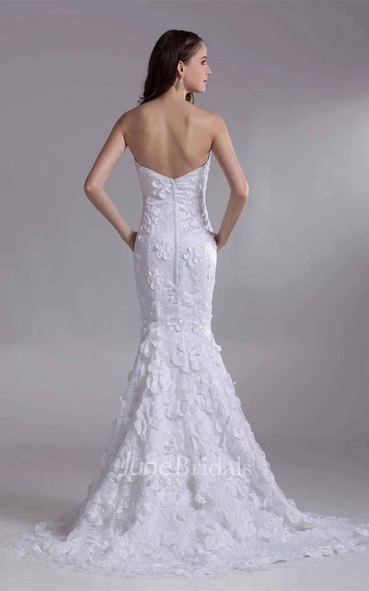 strapless lace mermaid dress with brush train and floral embellishment