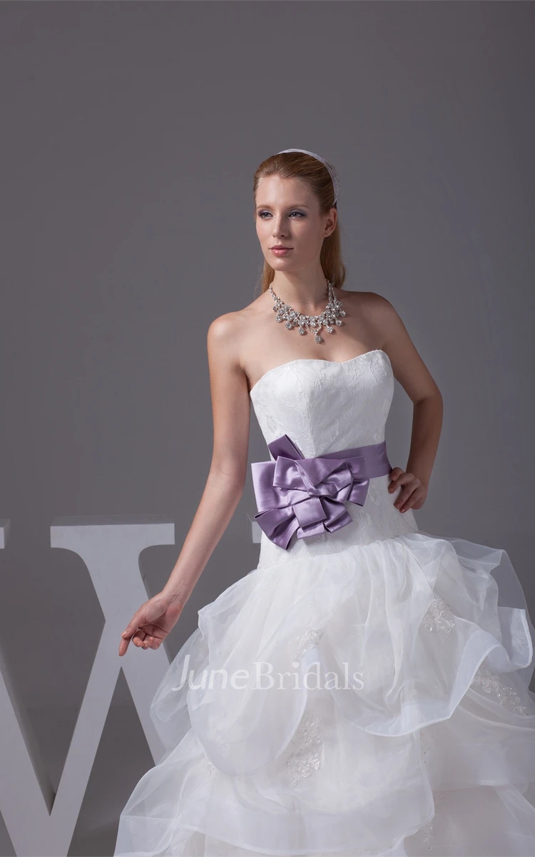 Strapless Ruffled Ball Gown with Bow and Appliques